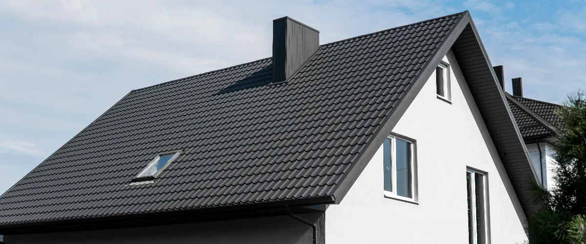 a house with a dark-colored metal roof system
