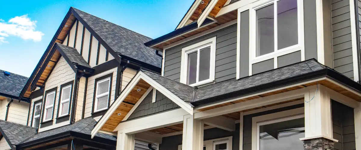 a row of new, modern suburban houses featuring a mix of architectural styles and materials