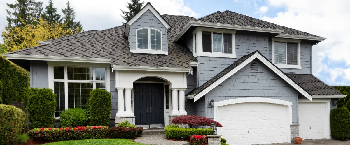 a house with a roof covered with dark gray asphalt shingles