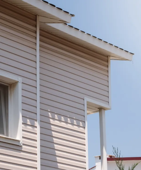 a house with horizontal lap siding, which could be vinyl or fiber cement (Hardie board)