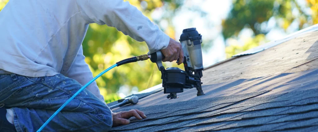 Close-up view of newly installed durable asphalt shingles on a modern residential house roof.