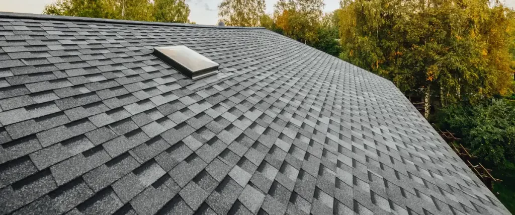 A freshly installed modern residential roof showcasing clean lines and durable shingles.