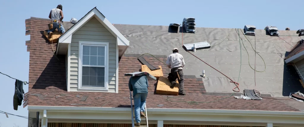 Close-up of a standard residential roof insurance policy document on a desk.