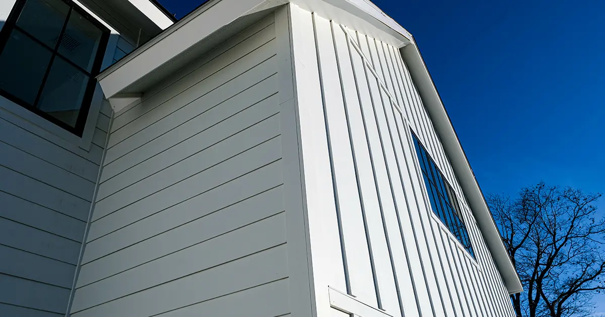 White board and batten siding installed on modern custom home exterior